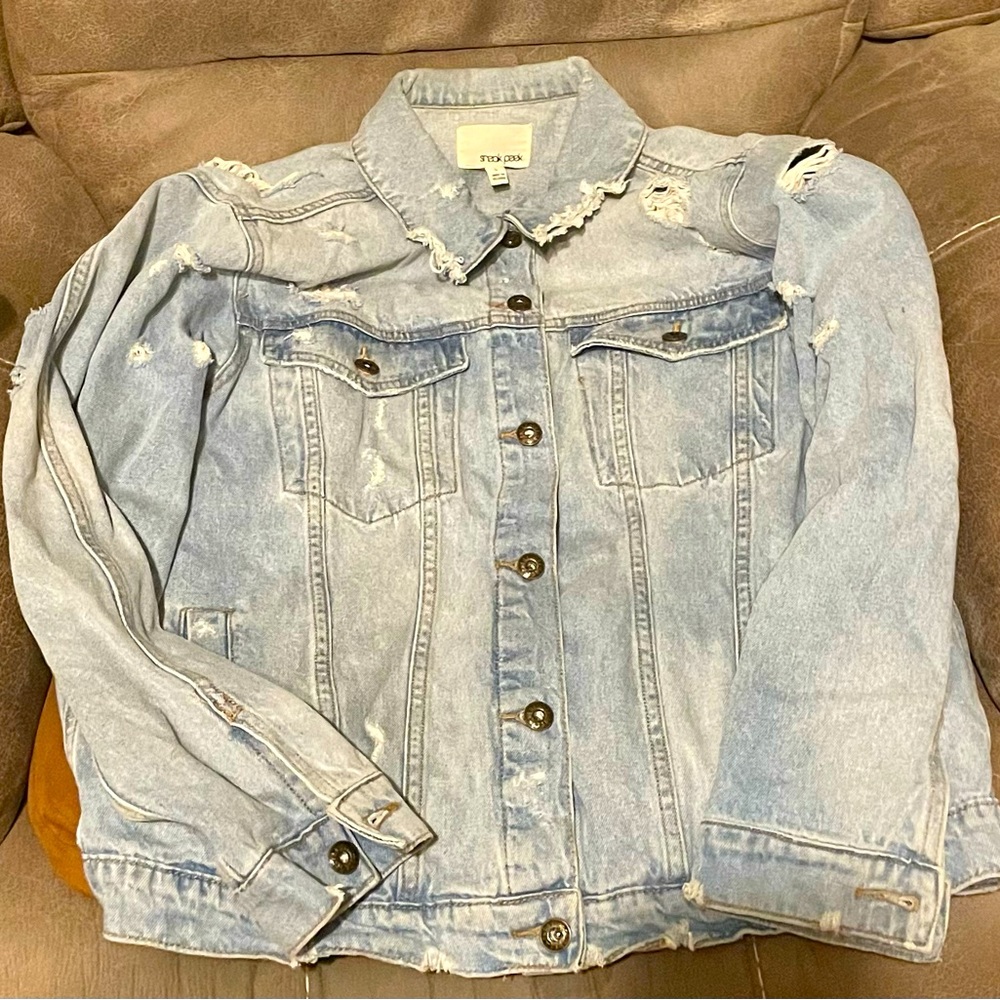 Distressed and vintage light blue denim jacket perfect for spring!